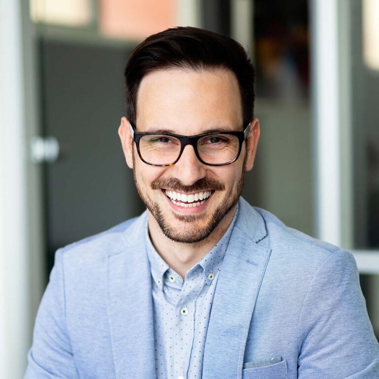 portrait-of-handsome-successful-businessman-holdin-LLMNZ58